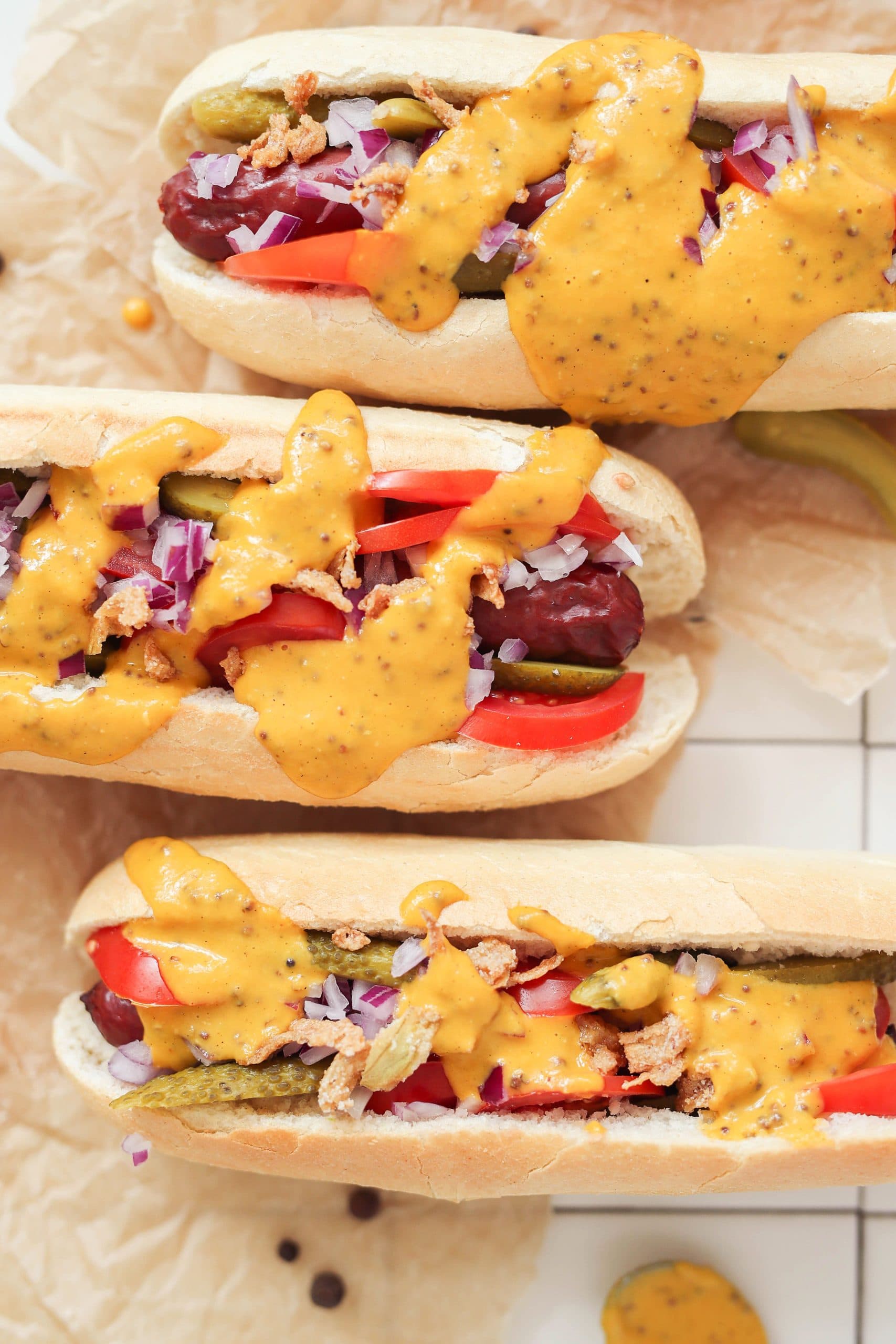 hot-dog-with-sauce-white-surface.jpg